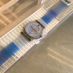 SWATCH super slim SFK170. Case & new battery included. Water resistant.